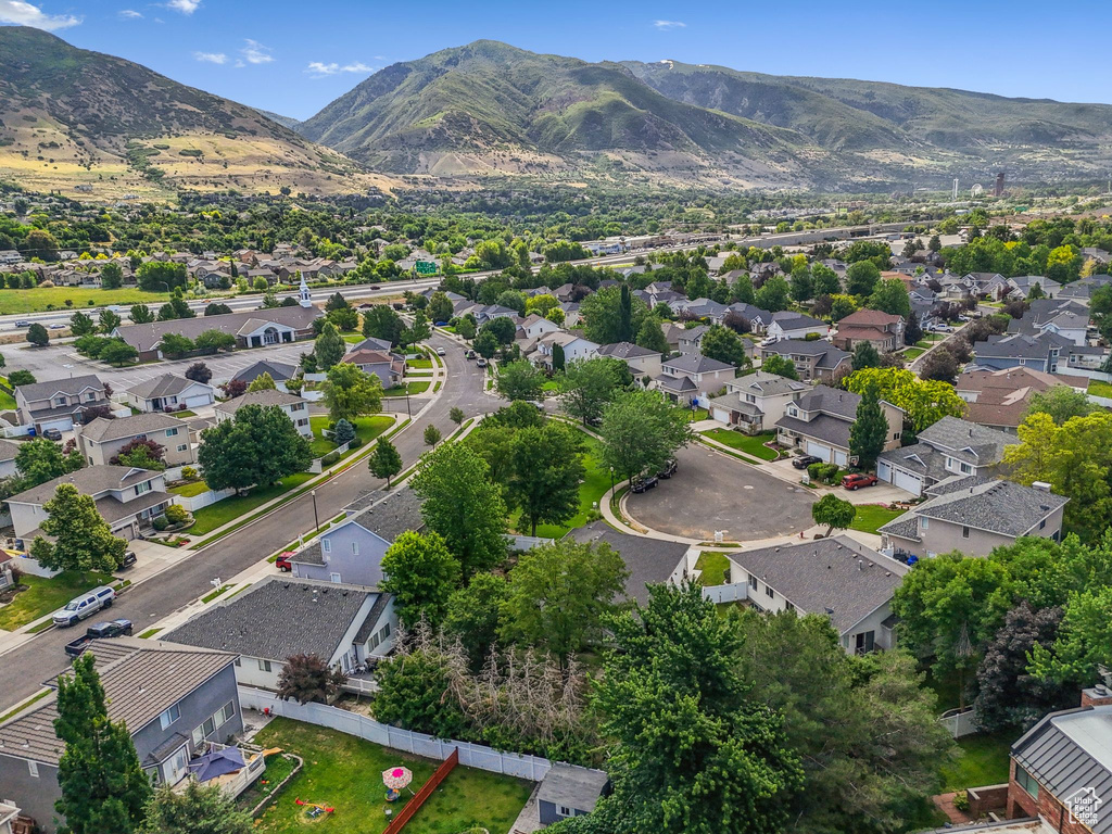 Aerial view of residential area featuring a mountain backdrop