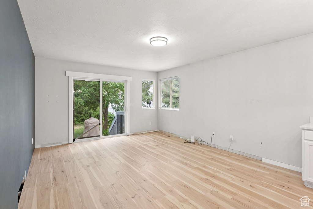 Empty room featuring light wood-style flooring and baseboards