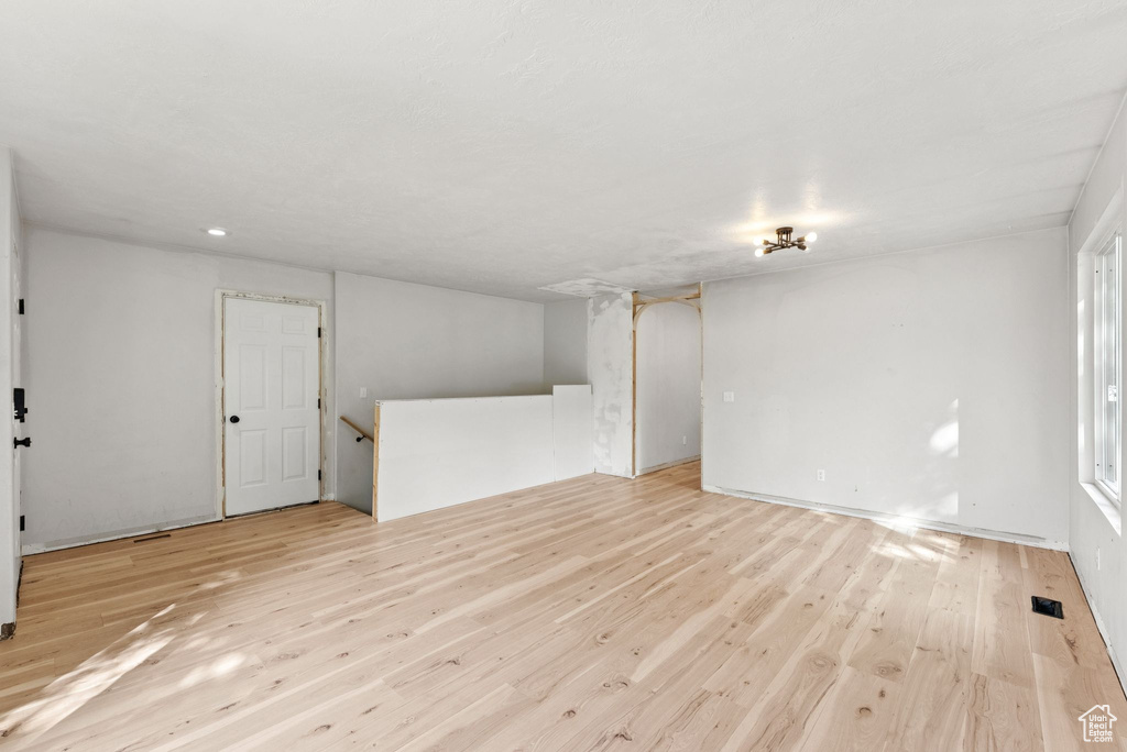Unfurnished living room with light wood-type flooring