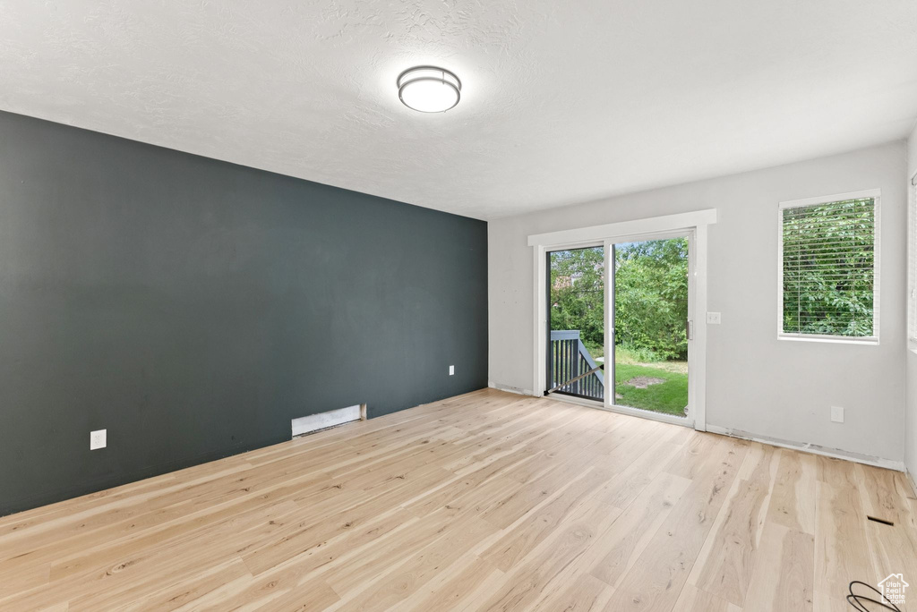 Spare room with wood finished floors