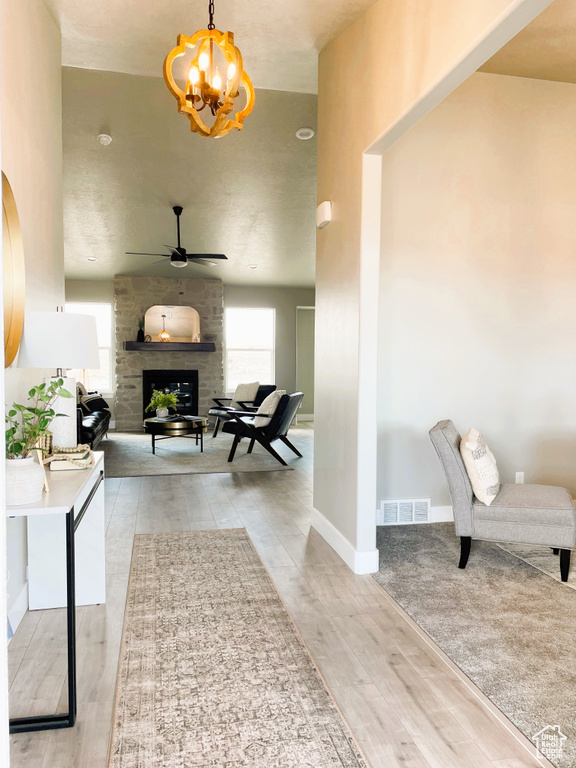 Hallway featuring a chandelier and wood finished floors
