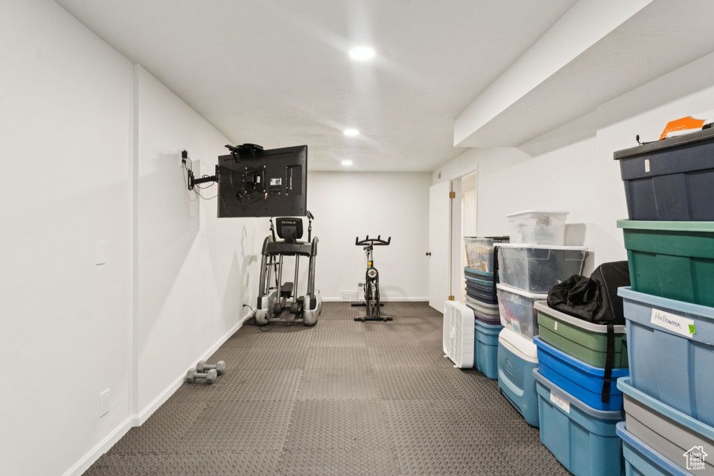 Exercise area featuring recessed lighting and carpet flooring