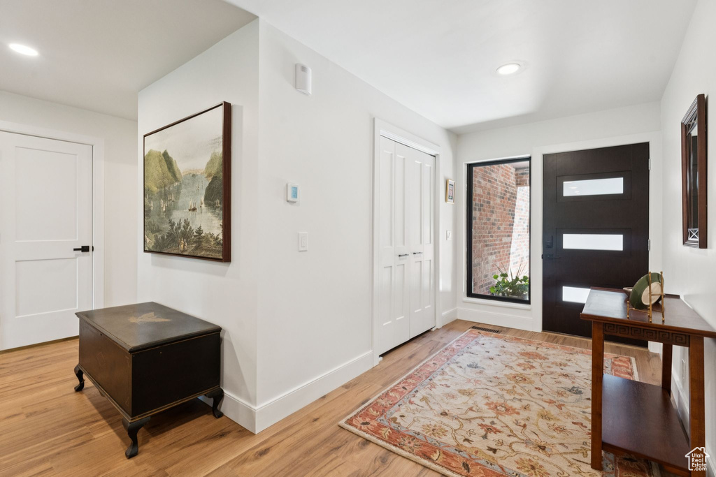 Entryway featuring light wood finished floors and recessed lighting