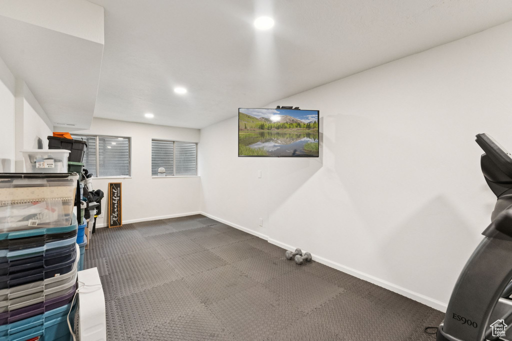 Exercise area with carpet flooring and recessed lighting