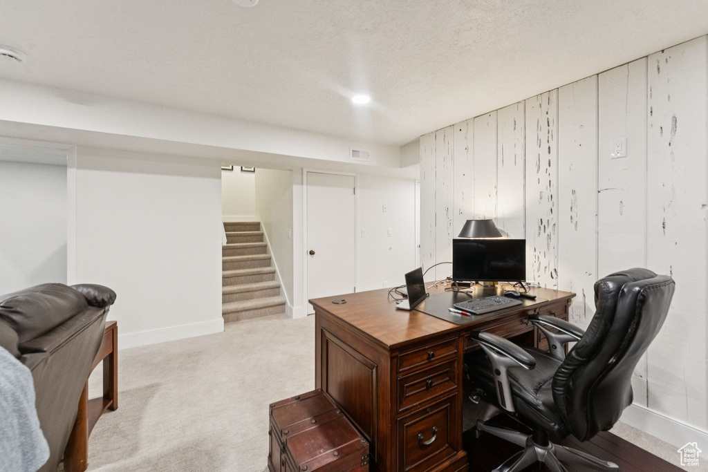Office area with light carpet and baseboards