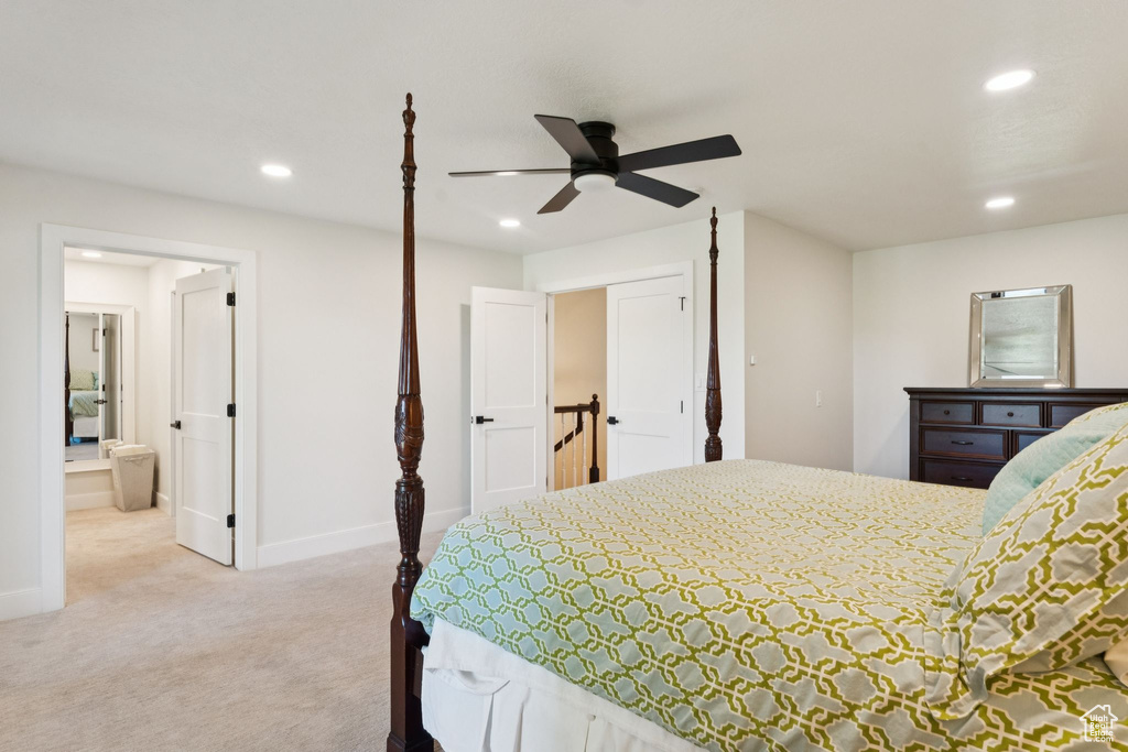 Carpeted bedroom with recessed lighting, connected bathroom, and ceiling fan