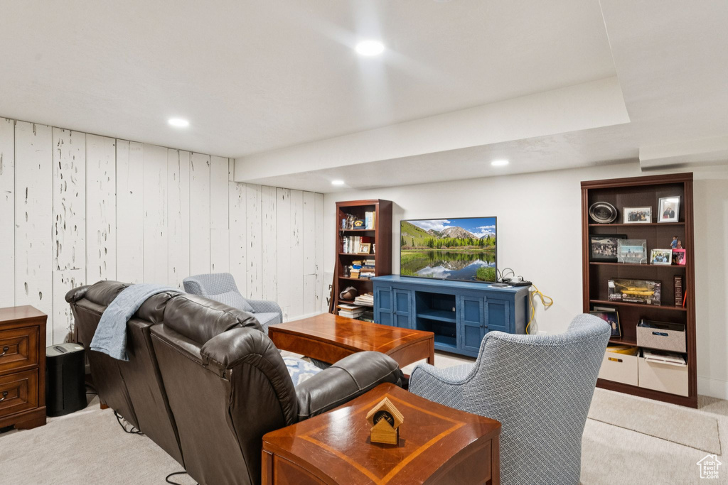 Living room with light colored carpet and recessed lighting