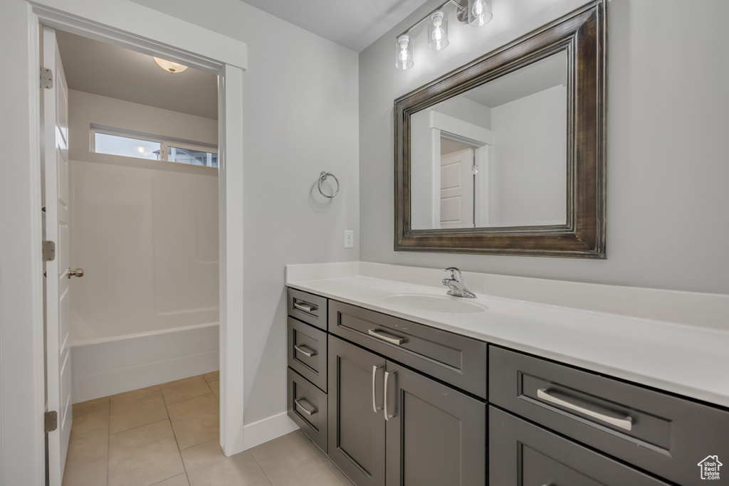 Bathroom with vanity and tile patterned floors