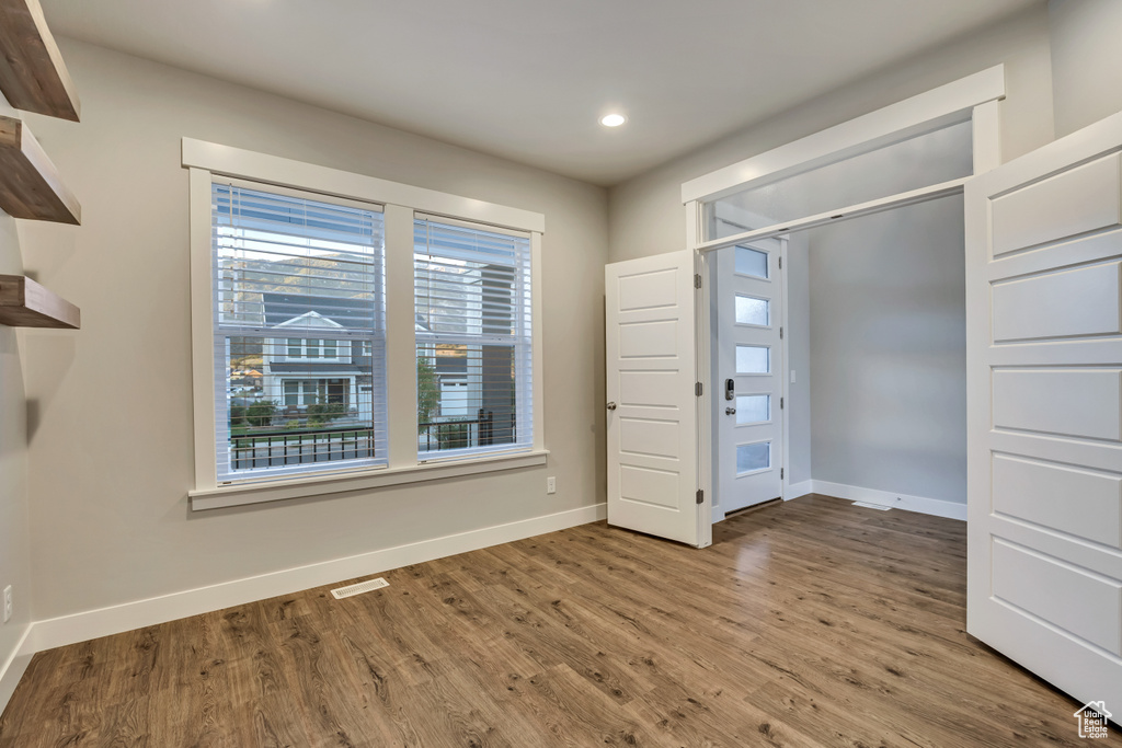 Unfurnished bedroom featuring wood finished floors and recessed lighting