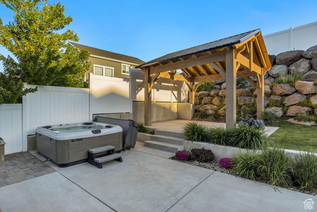 View of patio / terrace with a gazebo and a hot tub