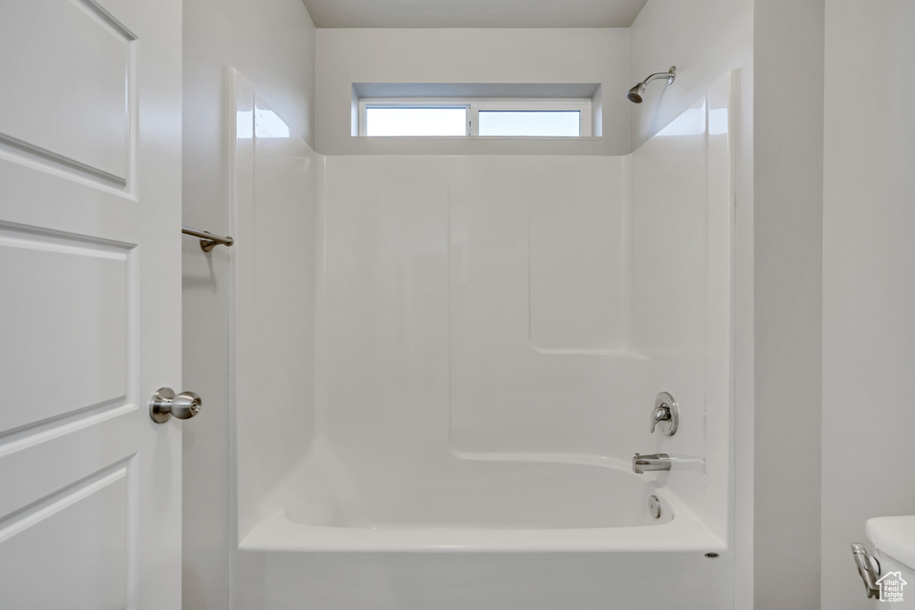 Bathroom featuring  shower combination and toilet