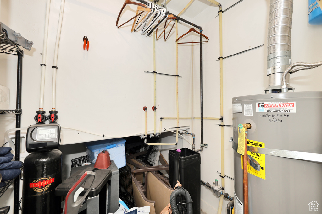 Utility room featuring water heater