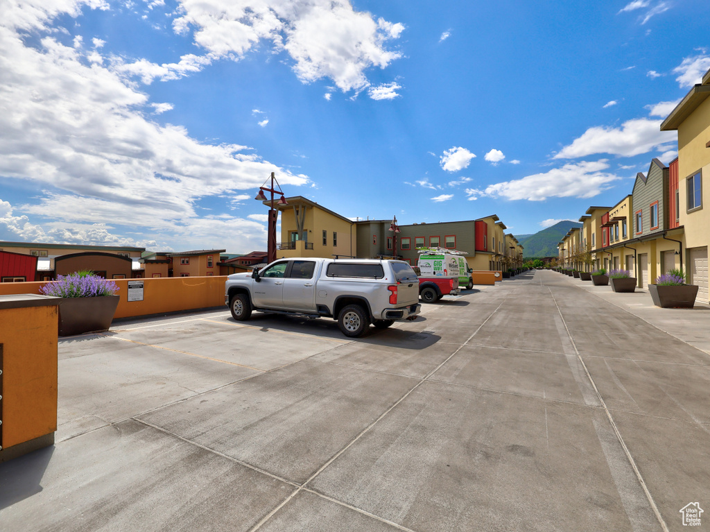 Uncovered parking lot with a residential view