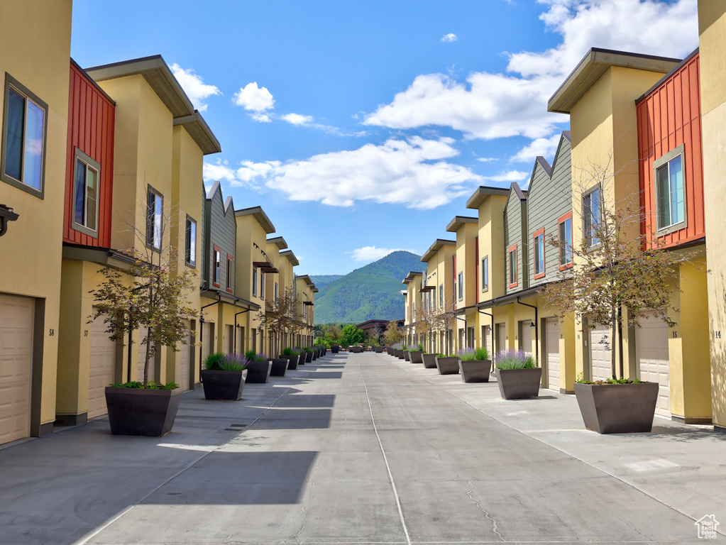 View of concrete alley featuring a residential view and a mountain view