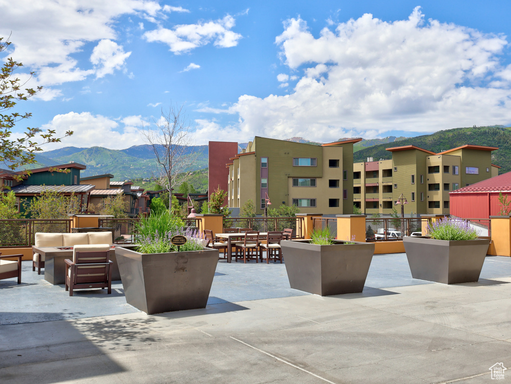 View of patio with outdoor lounge area and a mountain view
