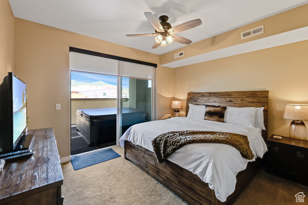 Bedroom featuring carpet flooring, a ceiling fan, and access to exterior