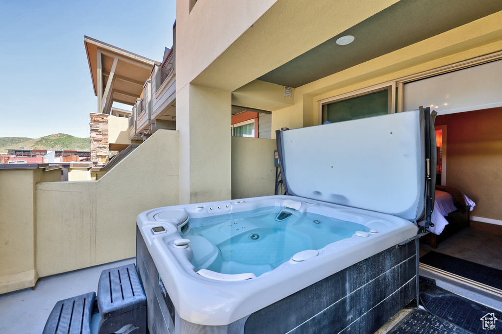 View of patio / terrace with a hot tub