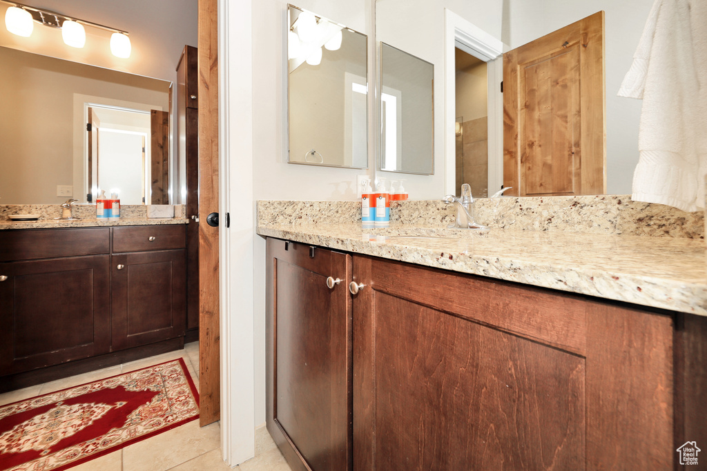 Bathroom with vanity and tile patterned floors