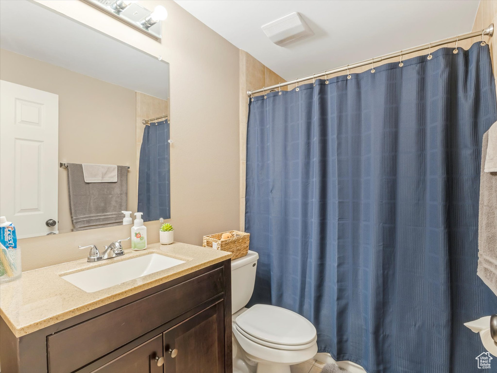 Bathroom with toilet and vanity