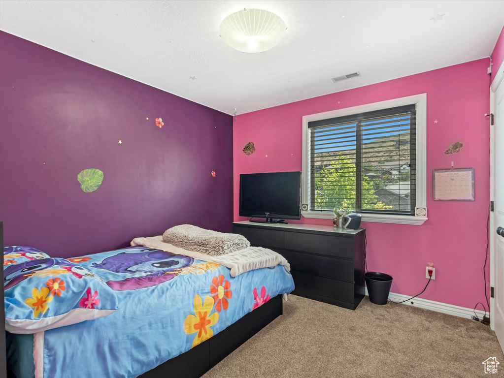 Carpeted bedroom with baseboards