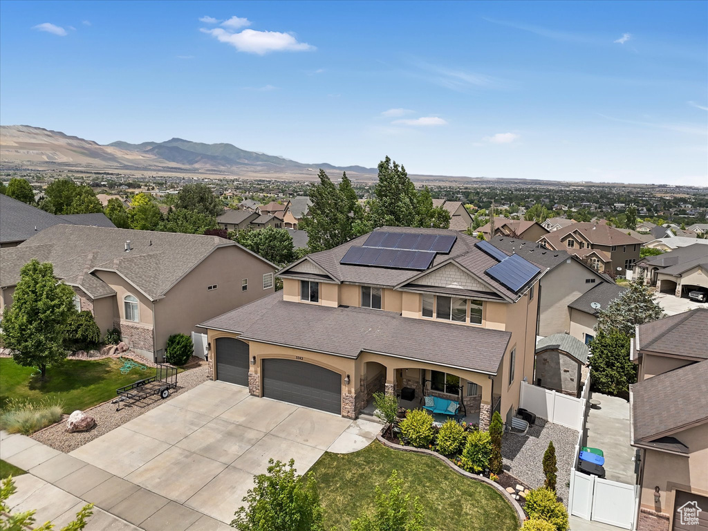 Aerial view of residential area featuring a mountain backdrop