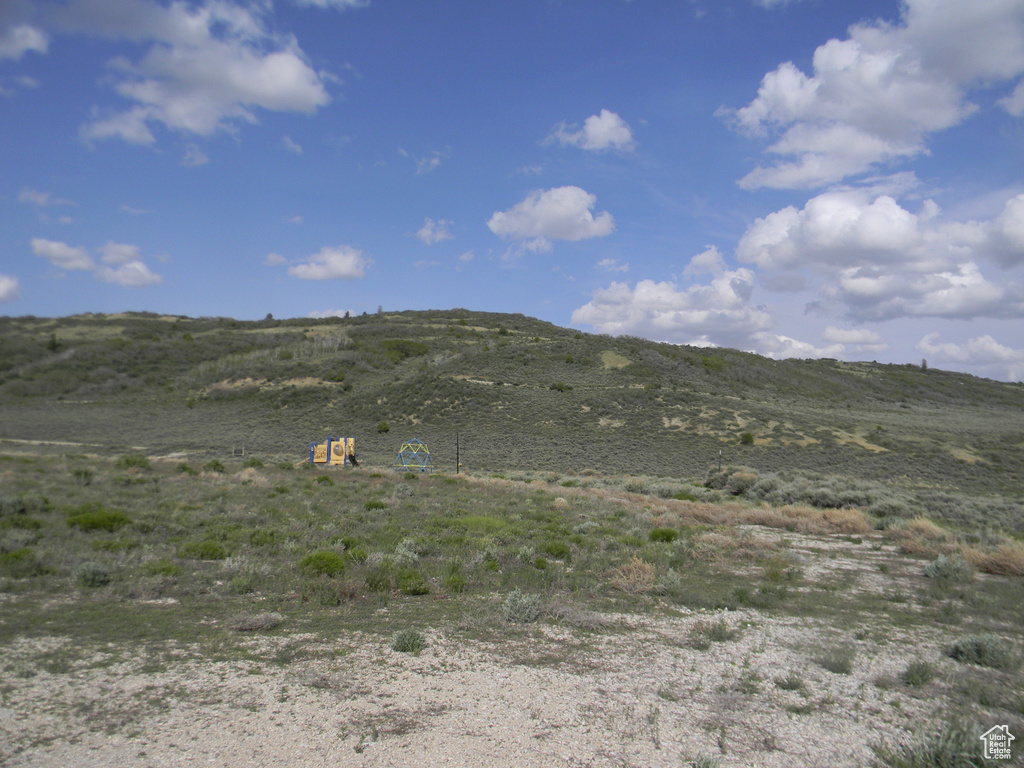 View of mountain background featuring rural landscape
