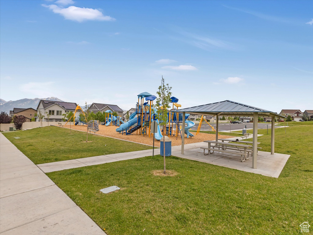 Community playground with a lawn and a gazebo