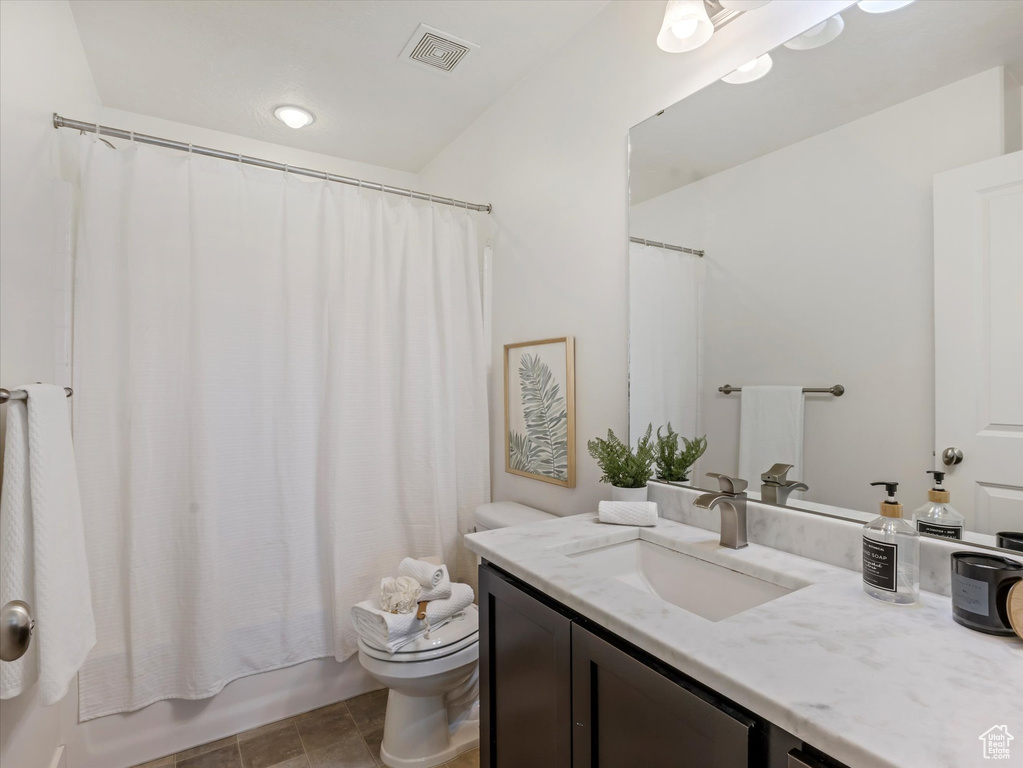 Full bathroom with vanity and shower / bath combo