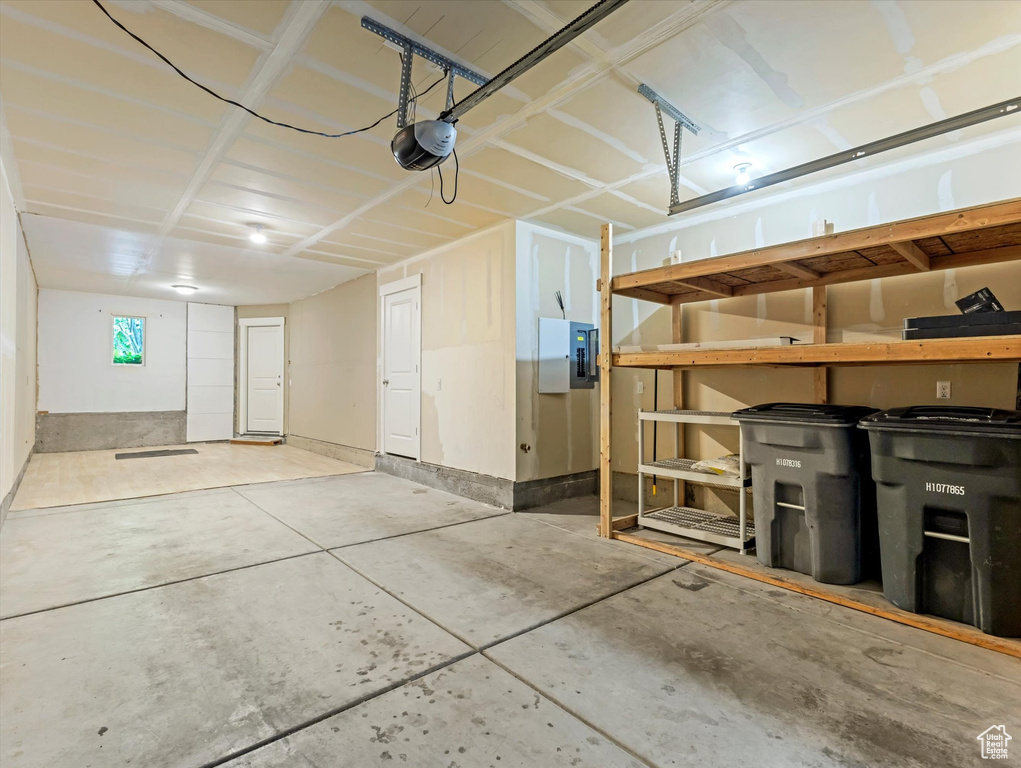 Garage with a garage door opener and electric panel