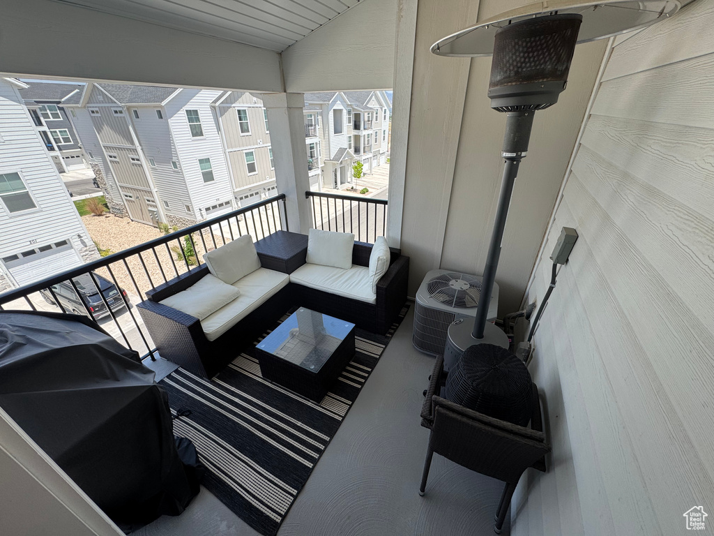 Balcony with outdoor lounge area and area for grilling