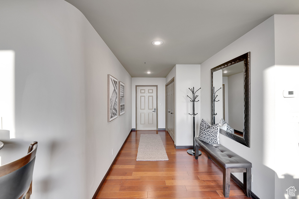 Hall featuring recessed lighting and wood finished floors