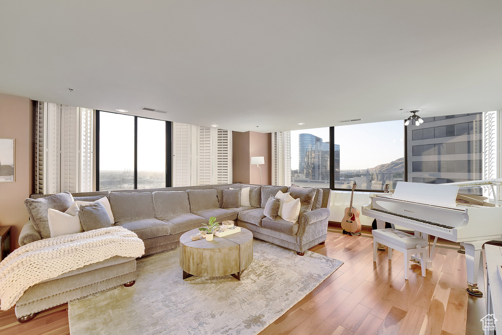Living room with plenty of natural light and light wood-style floors