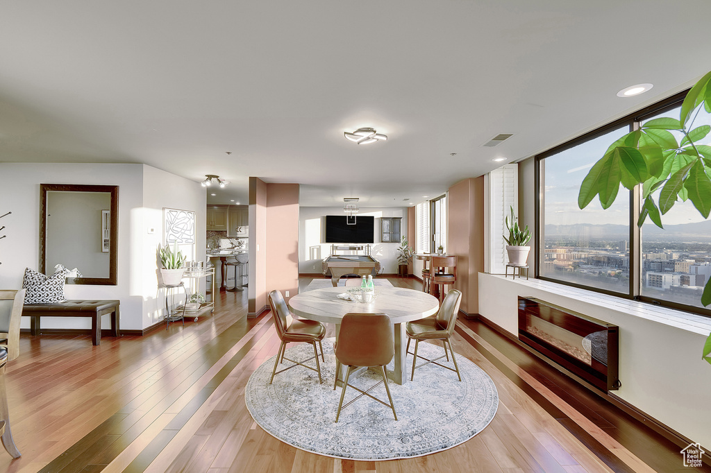 Dining room with light wood finished floors and baseboards