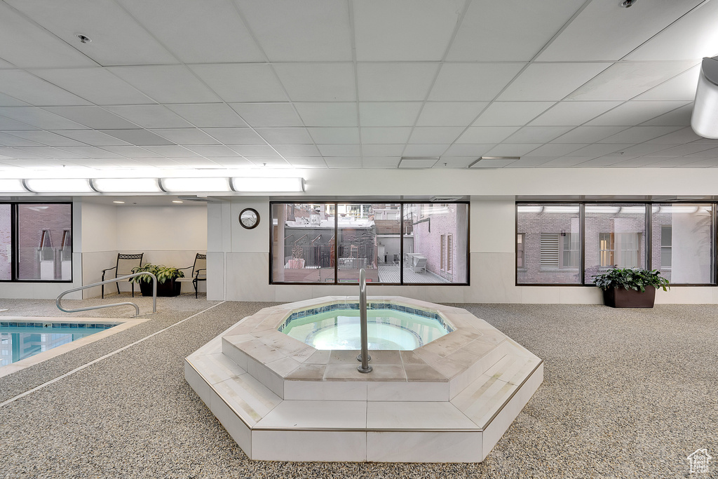 View of pool featuring a hot tub