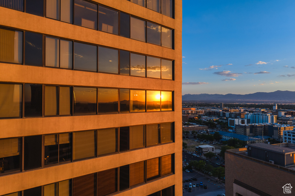 View of building exterior featuring a mountain view and a city view
