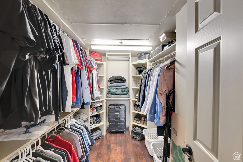 Spacious closet with wood finished floors