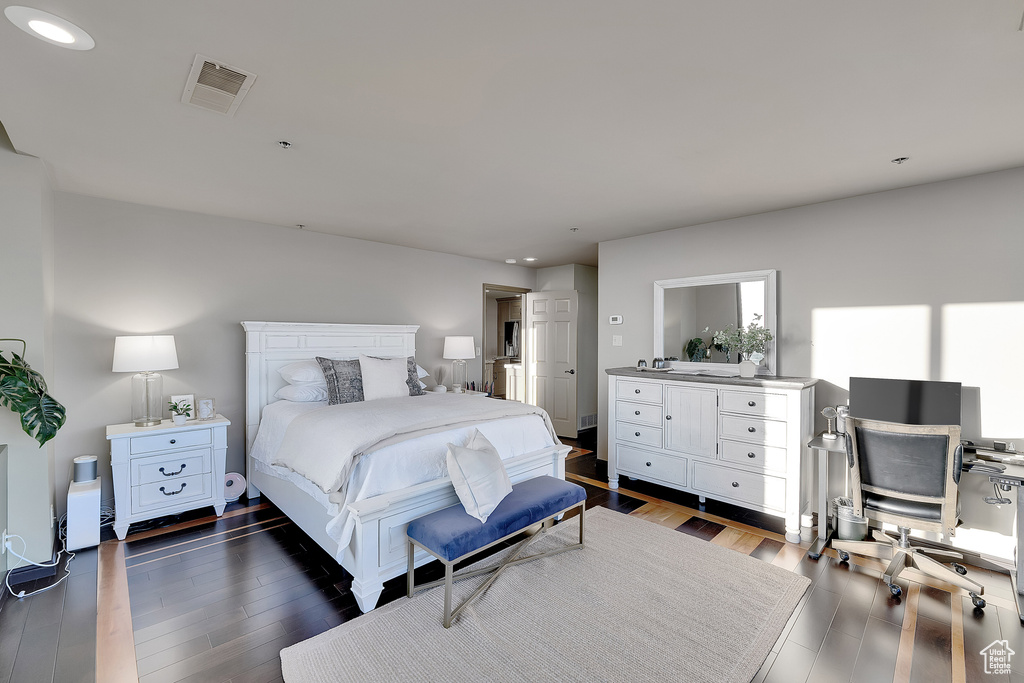 Bedroom featuring wood finished floors, recessed lighting, and a desk