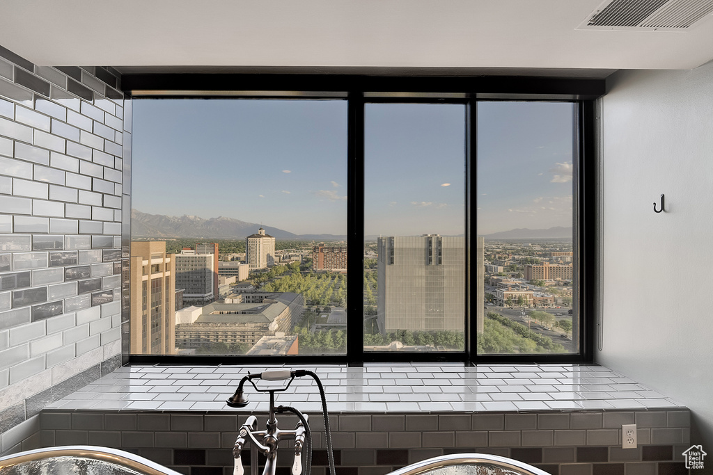 Kitchen featuring a mountain view and a city view