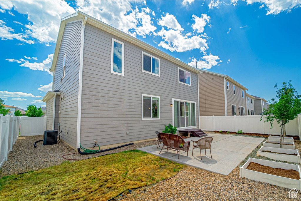 Back of property featuring a patio area, a fenced backyard, and a residential view