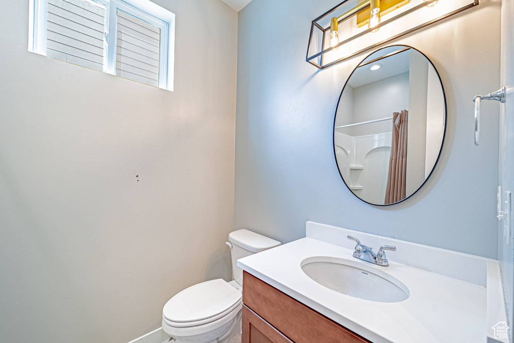 Full bathroom with vanity and a shower with curtain