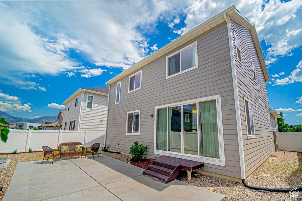 Back of house featuring a patio and a fenced backyard