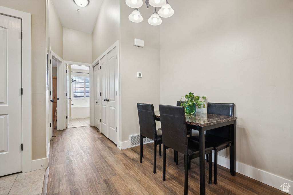 Dining room with a chandelier and wood finished floors