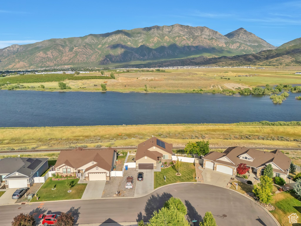 Aerial perspective of suburban area featuring a water and mountain view