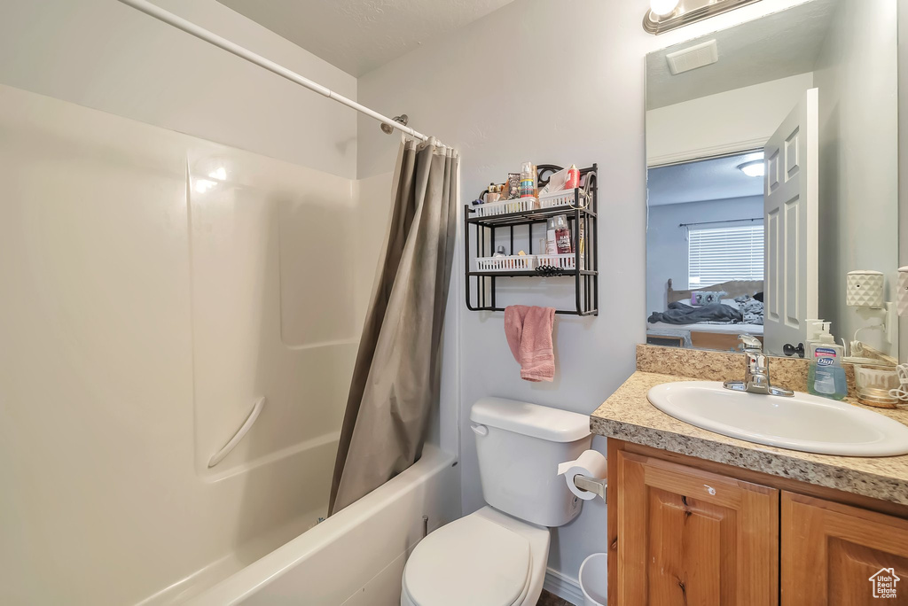 Full bath featuring vanity and shower / bath combo