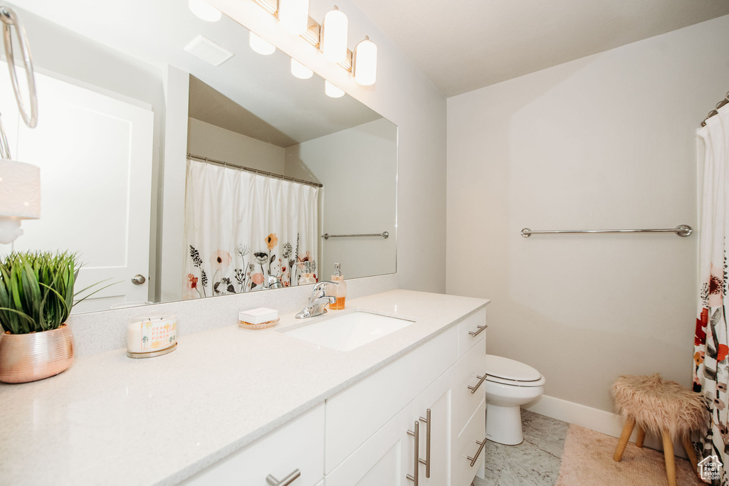 Bathroom featuring vanity and a shower with curtain