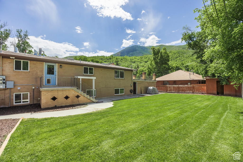 Rear view of house with a mountain view