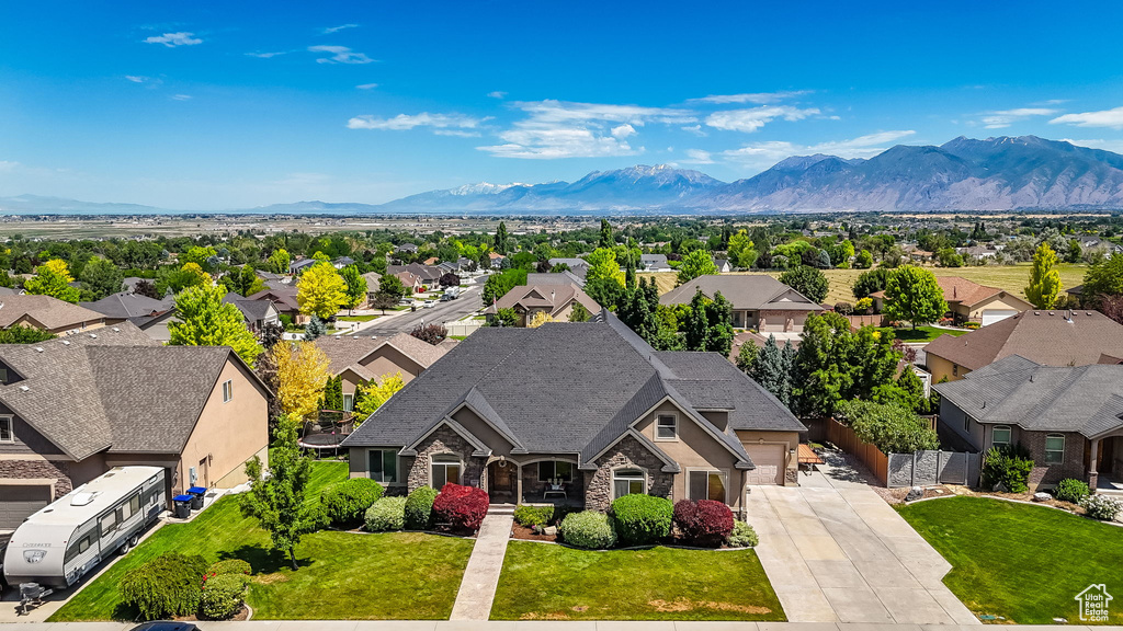 Aerial view of residential area featuring mountains