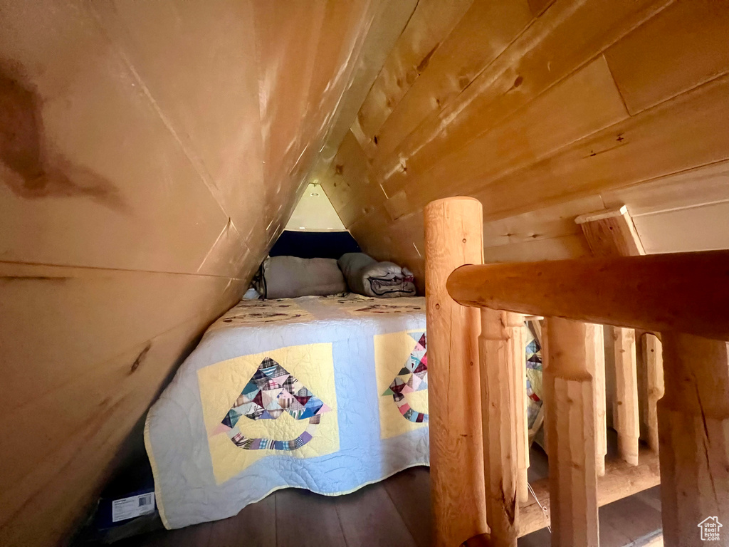 Bedroom featuring lofted ceiling