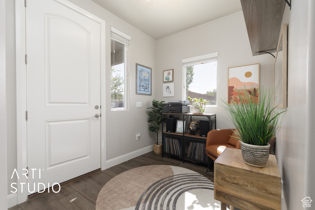 Entrance foyer featuring wood finished floors and baseboards