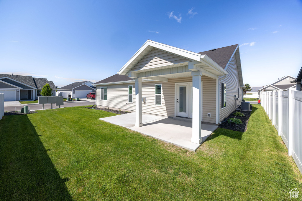 Rear view of property featuring a patio